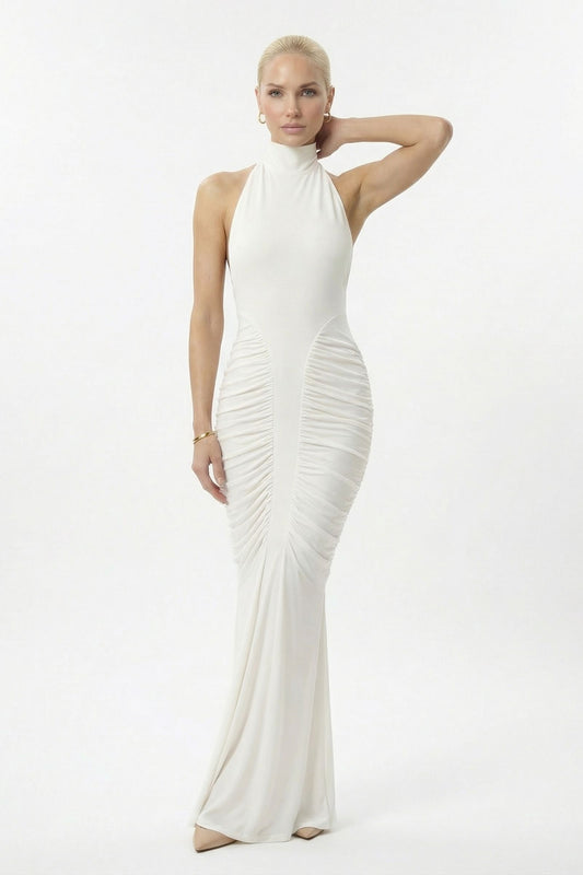 Woman wearing a white halter neck gown on a white background